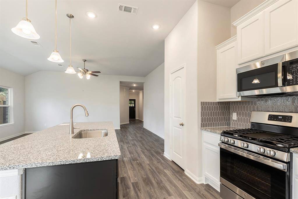 Kitchen and dining is open to the living room providing ease for entertaining