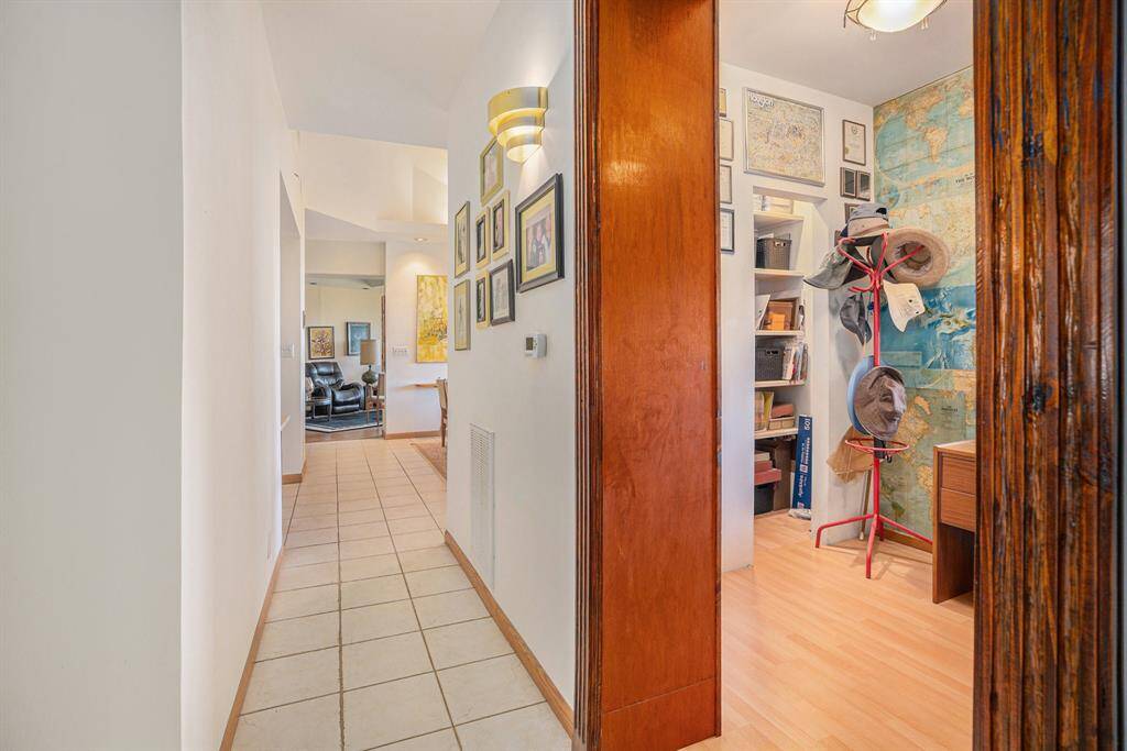 Hallway and study room on the right side with a built in wooden door frame