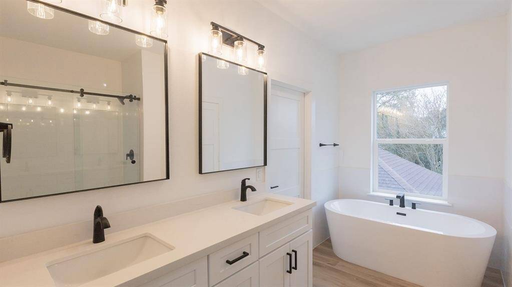 Primary bathroom brings an oasis of relaxation. Double sinks, stand up shower and soaking tub!