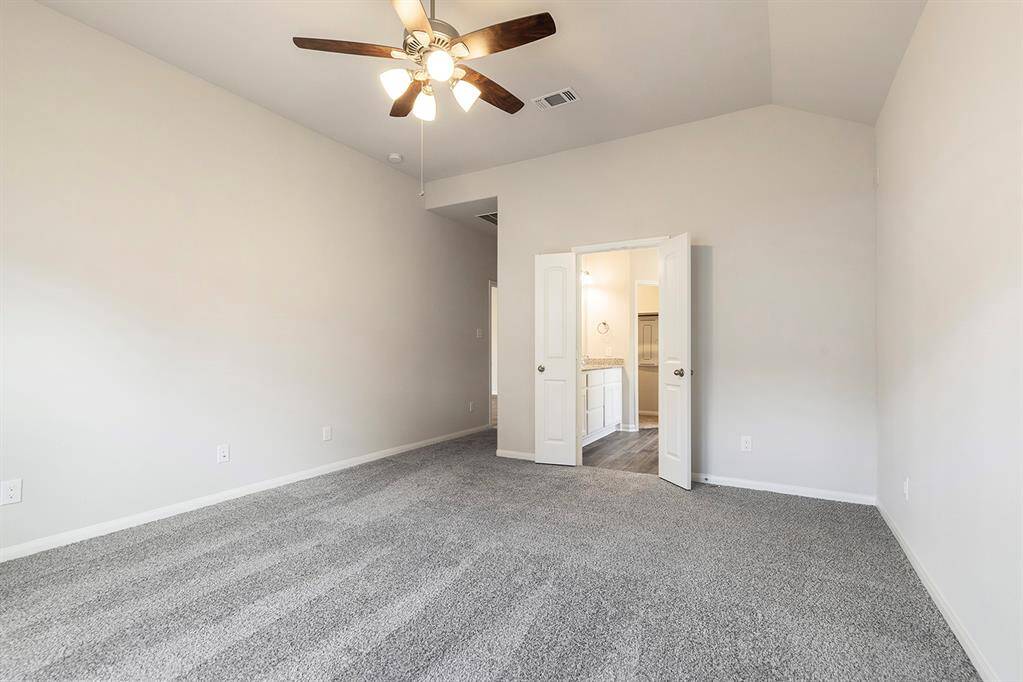 Another view of the primary bedroom