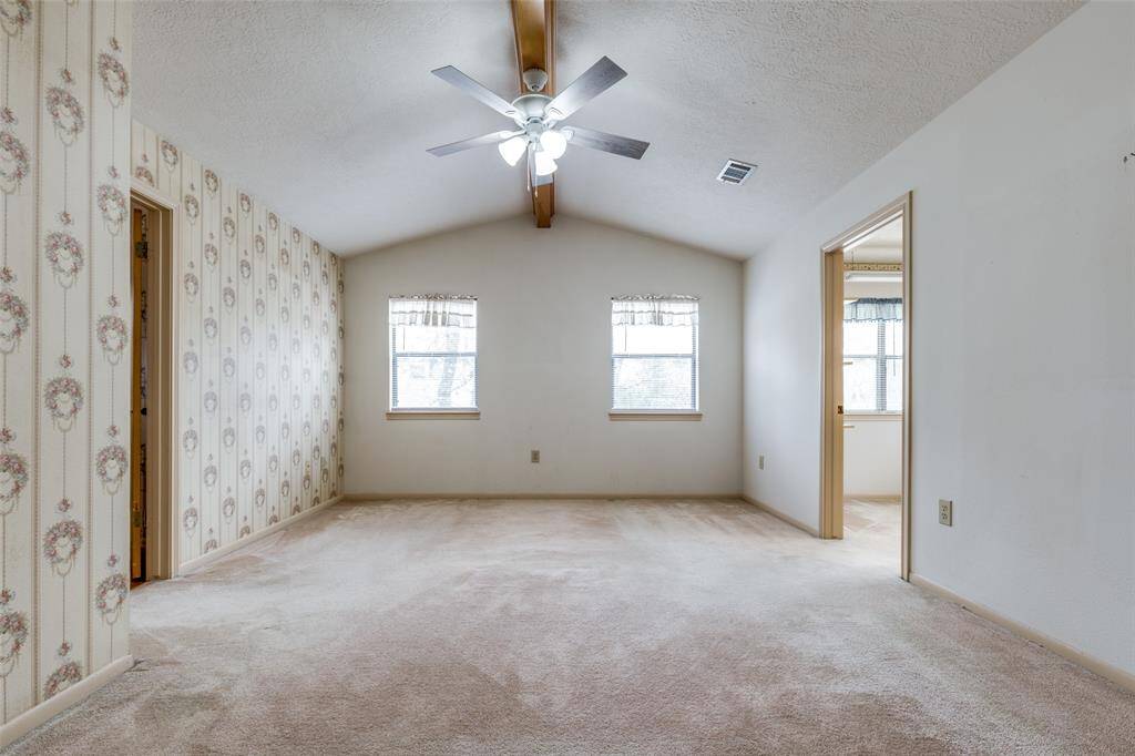 Spacious primary bedroom upstairs with office attached to the right