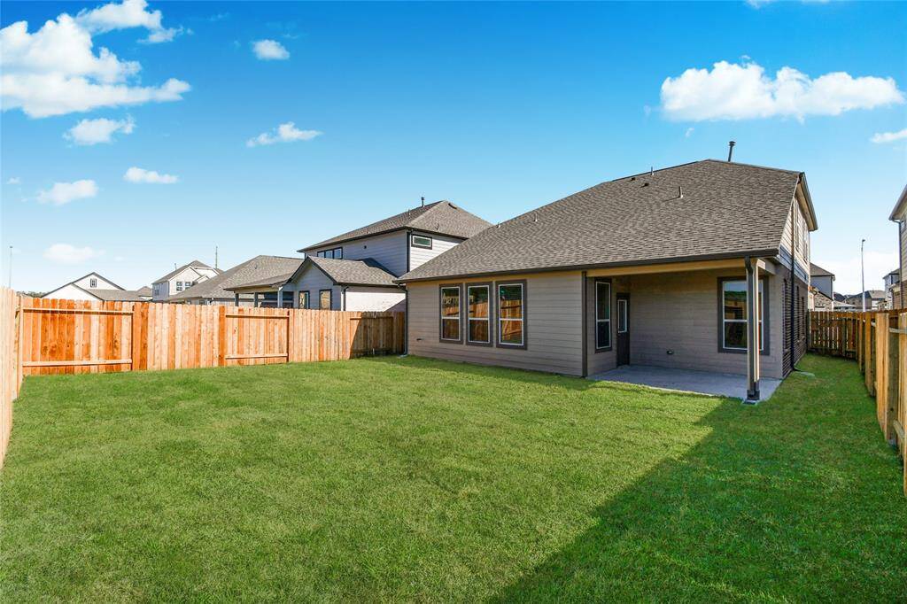 Come and see this spacious backyard with its beautiful covered patio. There is plenty ofroom for the kids to play and adults to relax. Perfect for your outdoor living space, patiofurniture, bbq pit, and so much more. The possibilities are endless! Sample photo of completed home with similar floor plan. Actual colors and selections may vary.