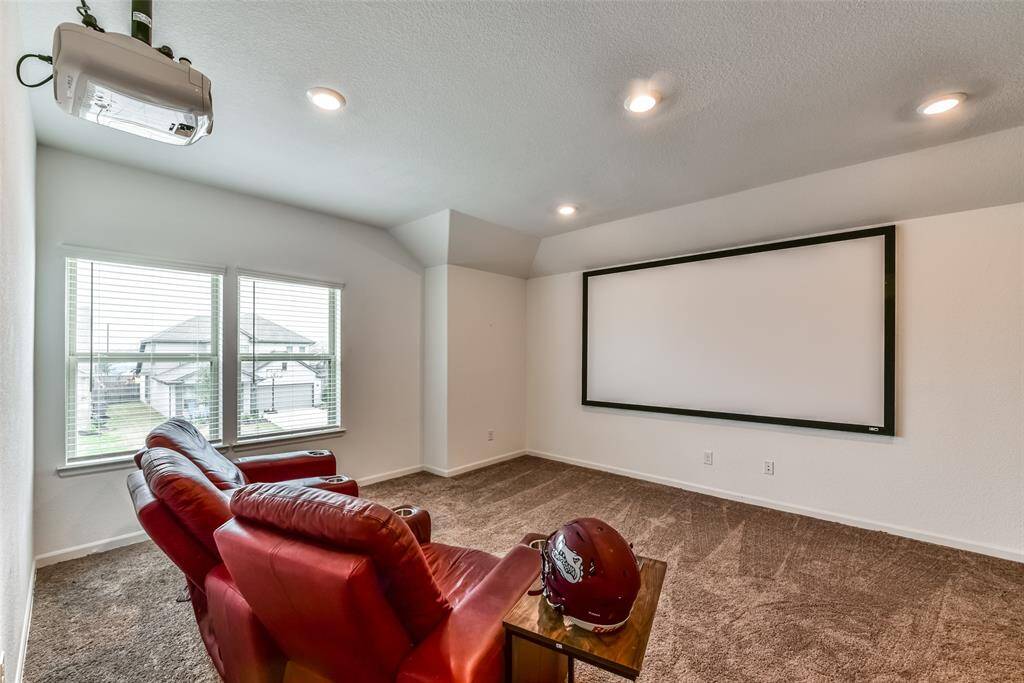 Make movie nights a weekly thing! Not shown to the right of the room is a small space for a desk or popcorn machine. Large storage closet is also in that area.
