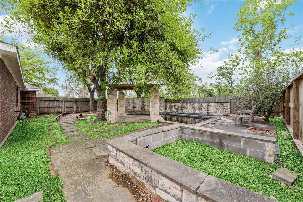 Beautiful and spacious garden with a fish pond