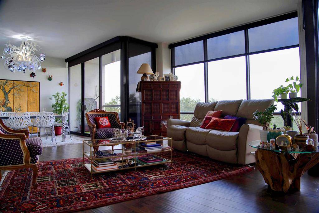 The open layout with the living and dining spaces flows naturally. The floor-to-ceiling windows provide ample natural light, while the 2 balconies offer private outdoor spaces perfect for relaxing, entertaining, or growing plants.