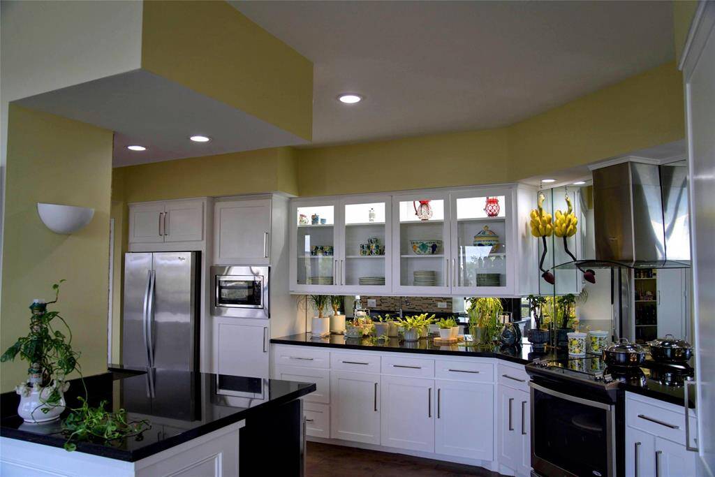 The kitchen is sleek and modern with ample storage for all your cooking needs.