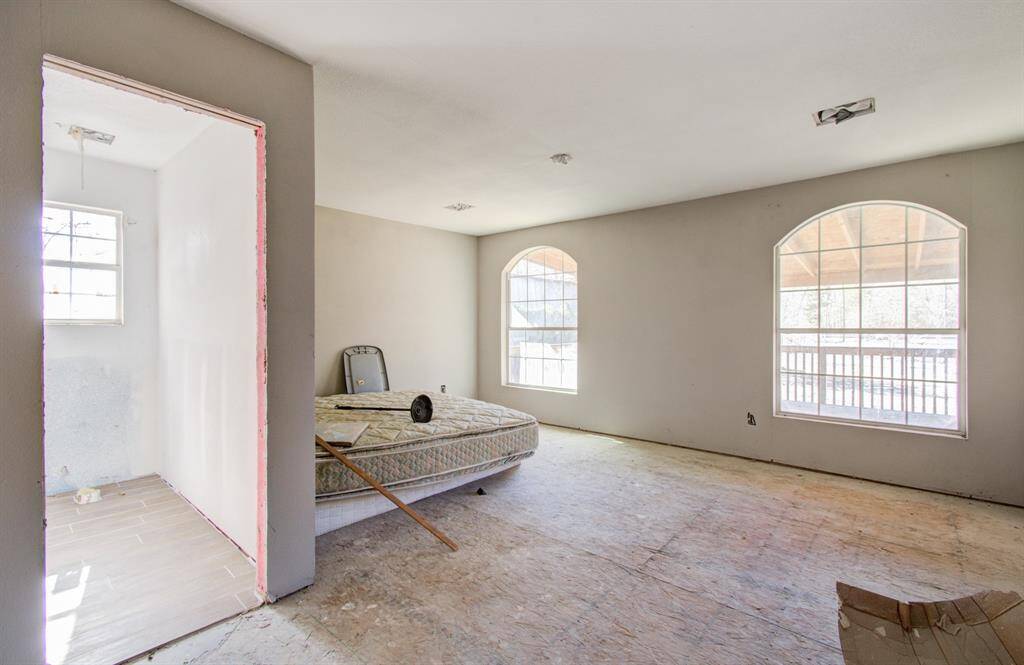The primary room, featuring plenty of natural light, is spacious and awaiting completion with your personal touch.