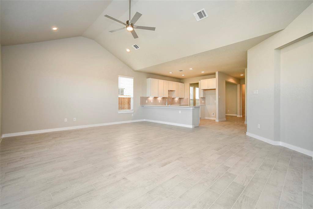Bring your loved ones and guests together in the inviting living room! Sample photo of completed home with similar floor plan. Actual colors and selections may vary.