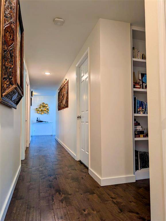 View of the hallway and custom bookshelf