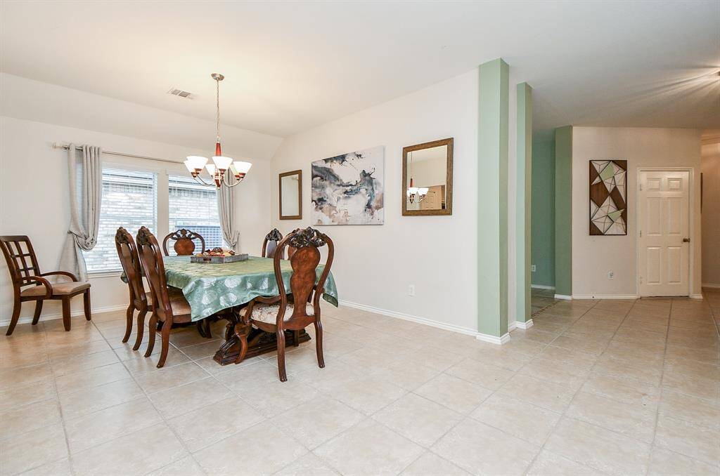 Spacious open-concept dining room, perfect for family gatherings.