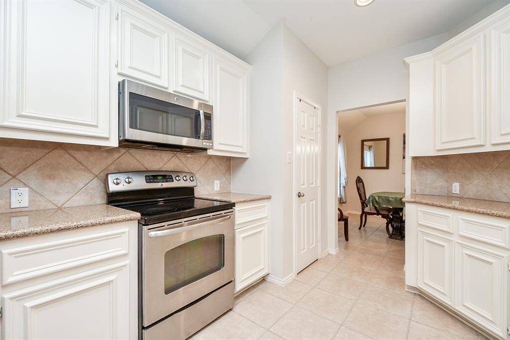 Generous cabinetry and expansive countertops.