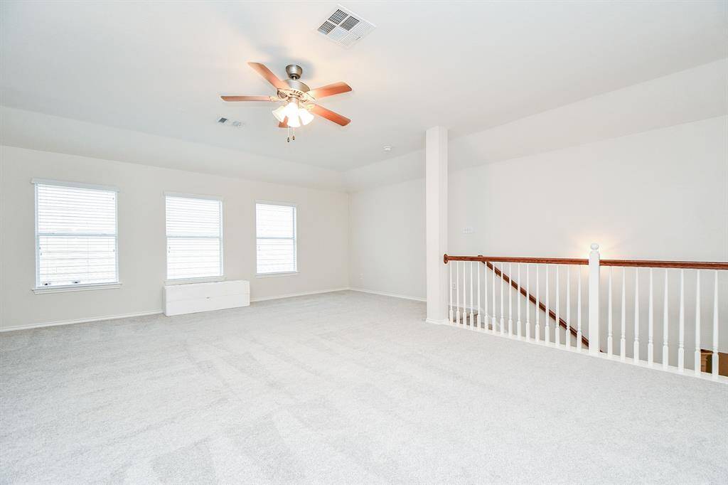 Spacious and bright game room with ample natural light.