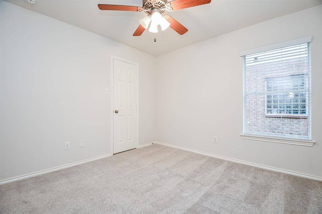 Spacious secondary bedroom featuring a convenient walk-in closet.