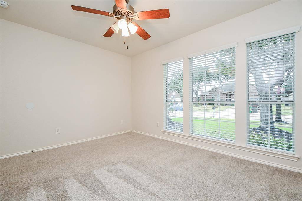 Bright secondary bedroom featuring a spacious walk-in closet.