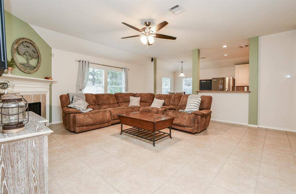 Seamless flow from living area to breakfast nook and kitchen.