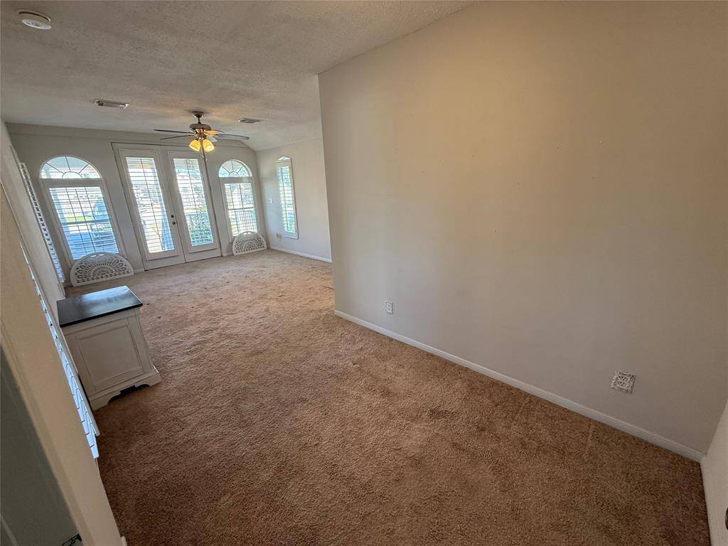Primary bedroom with sitting area.
