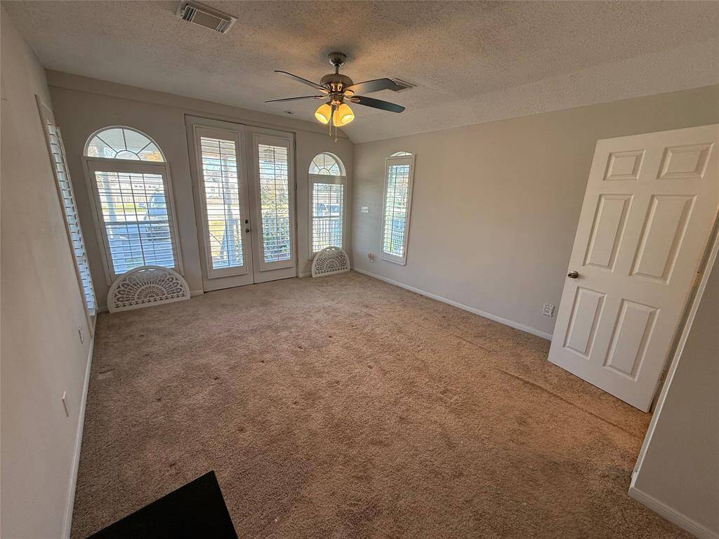 Primary Bedroom with french doors
