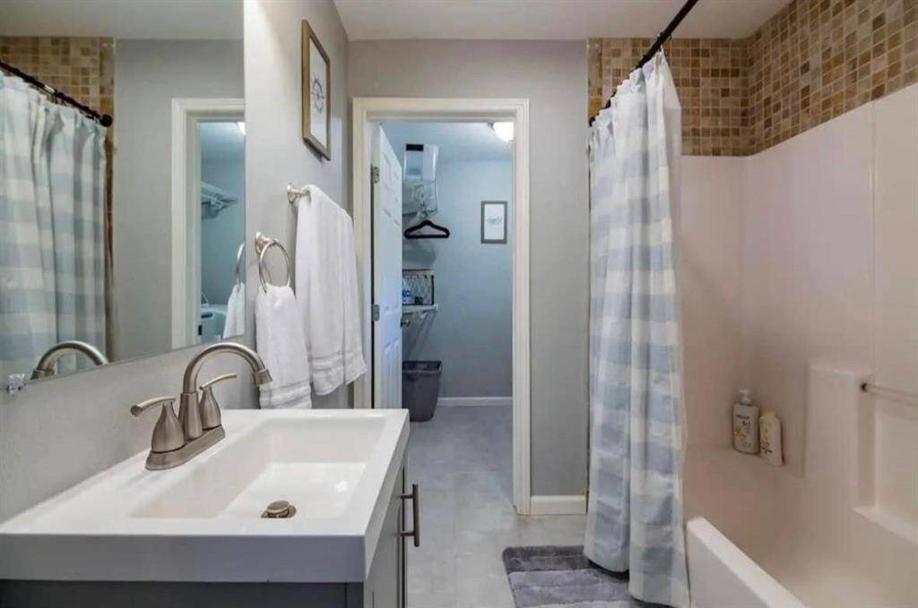 Unit 2 - second bathroom leading to laundry room