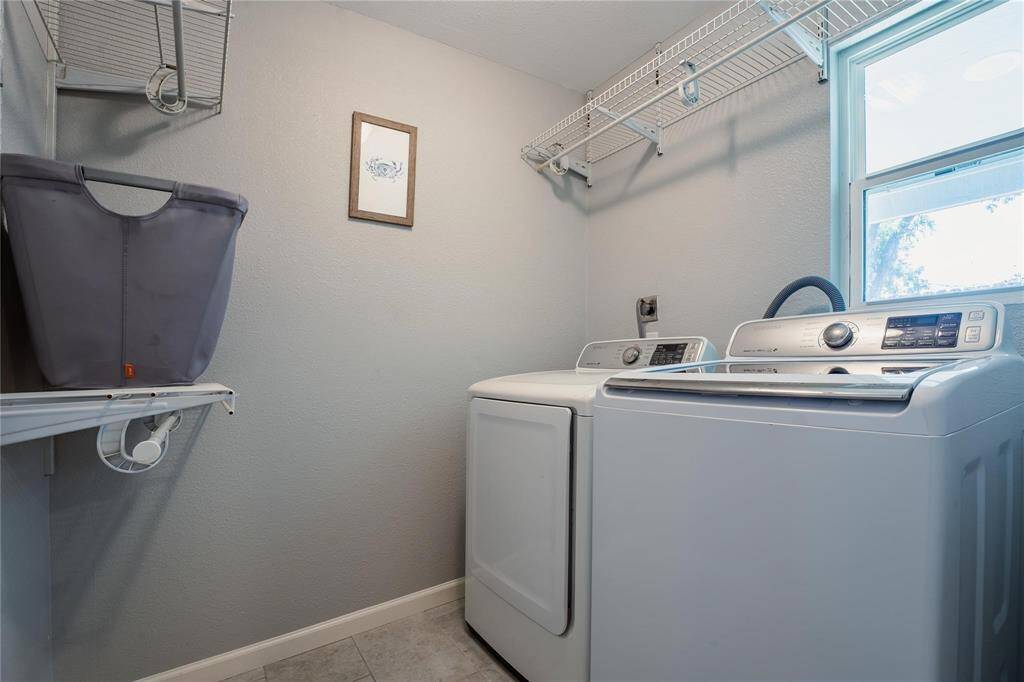 Unit 2 - laundry room with full-sized washer and dryer