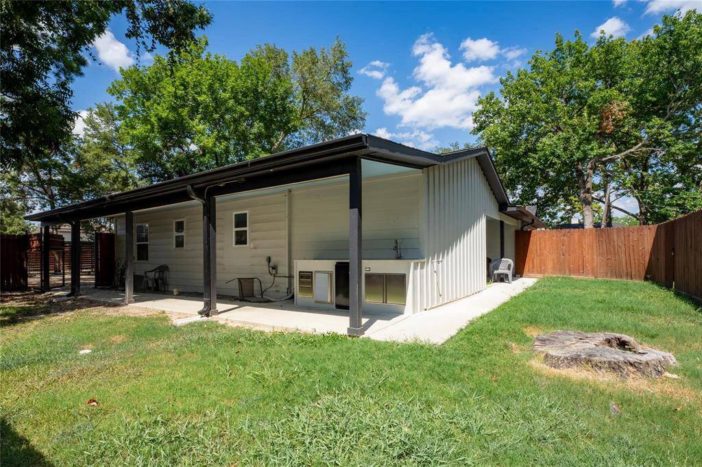 Unit 2 - double covered patios and spacious fenced-in back yard with outdoor kitchenette.