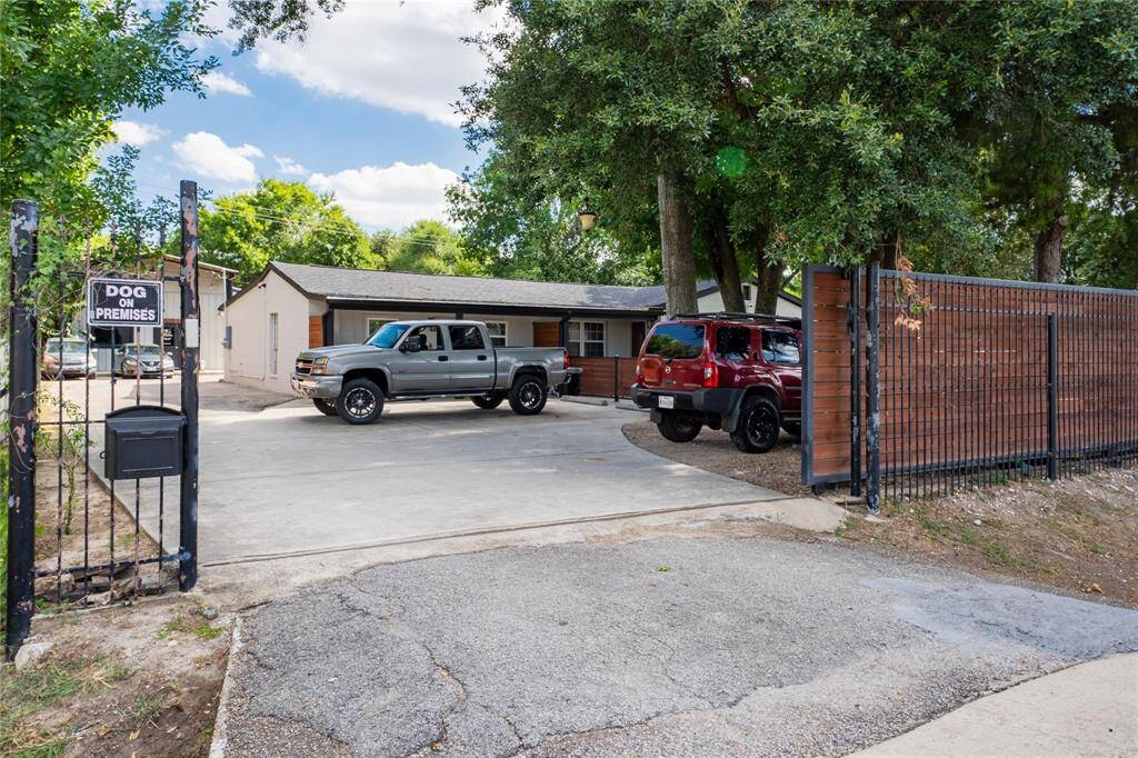 Driveway entrance to Unit 1 and Office with gate access.