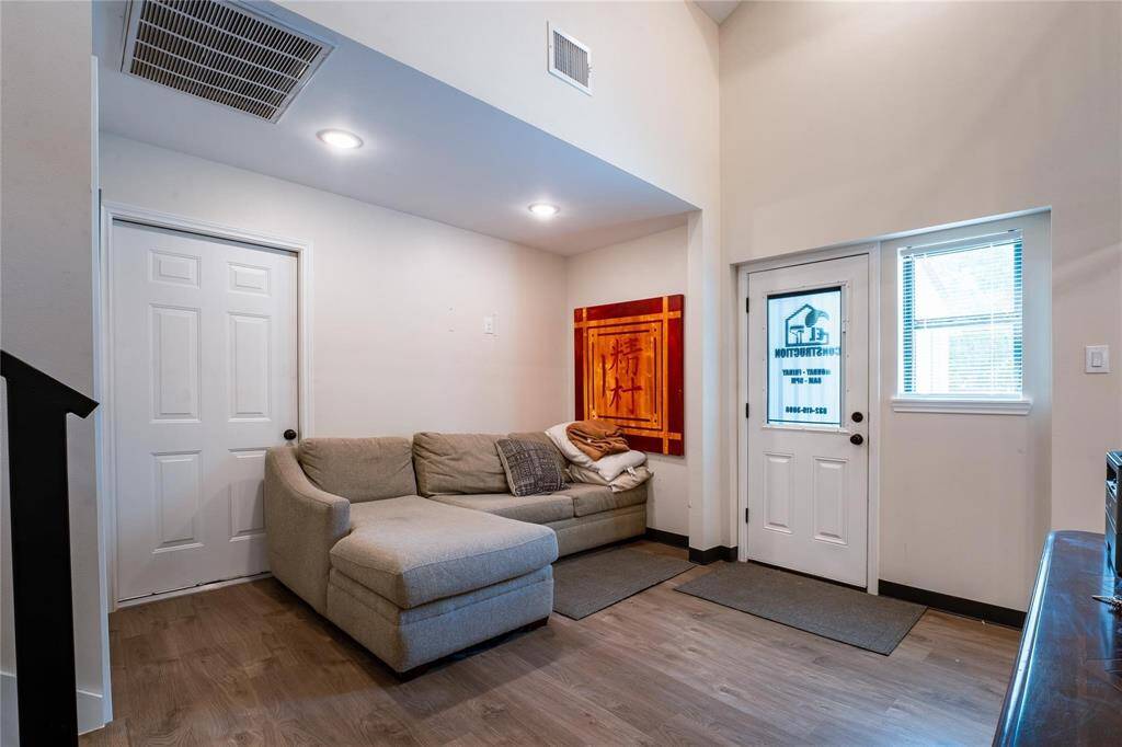 Office - living area with side access door and door connected to storage warehouse / flex room.