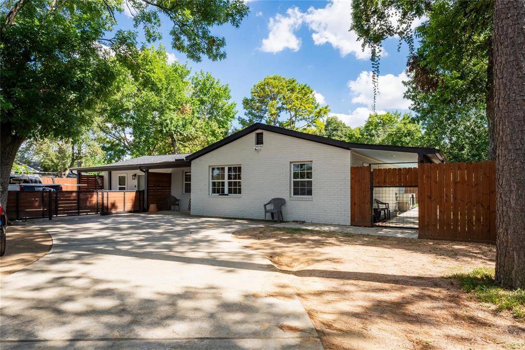 Unit 2 - front entrance, parking, and side fenced-in patio