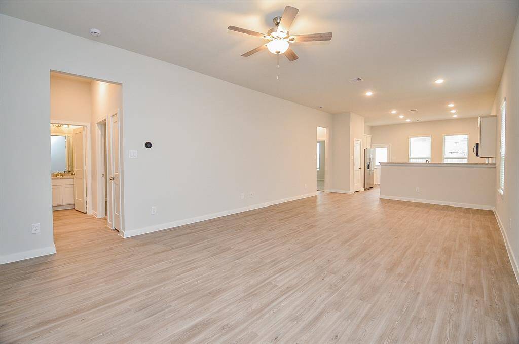 This sublime view of the seamlessly linked living/kitchen/dining areas are testimony to the timeless beauty and benefits of the open floor plan design concept, which gives you tremendous open, airy, unobstructed space to imprint your lifestyle!