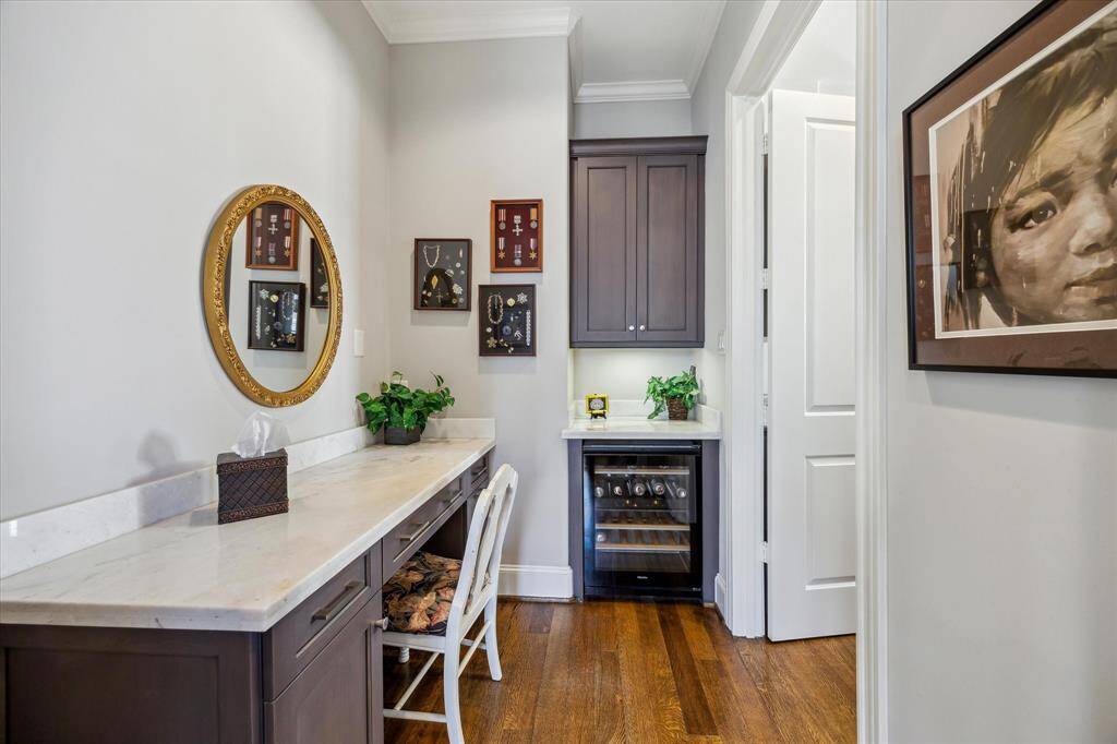 Cozy desk nook off the primary bedroom with a convenient under-counter beverage cooler.
