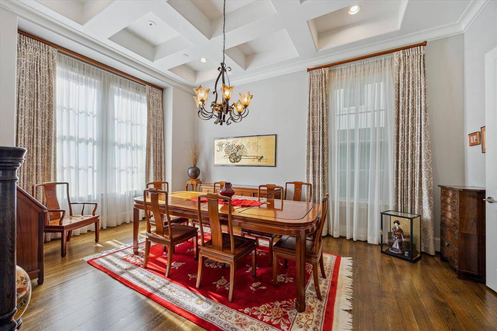Expansive 18x12 dining area with elegant custom drapes and sheer accents.