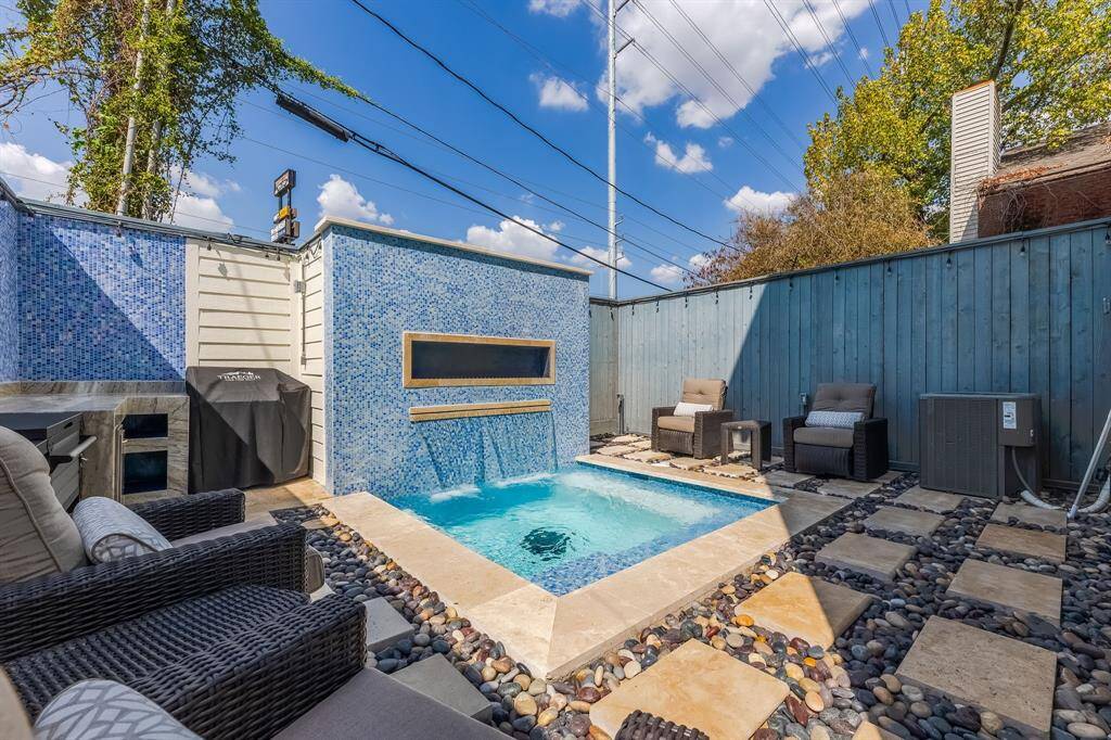 Pool with Travertine and polished river rock walkway