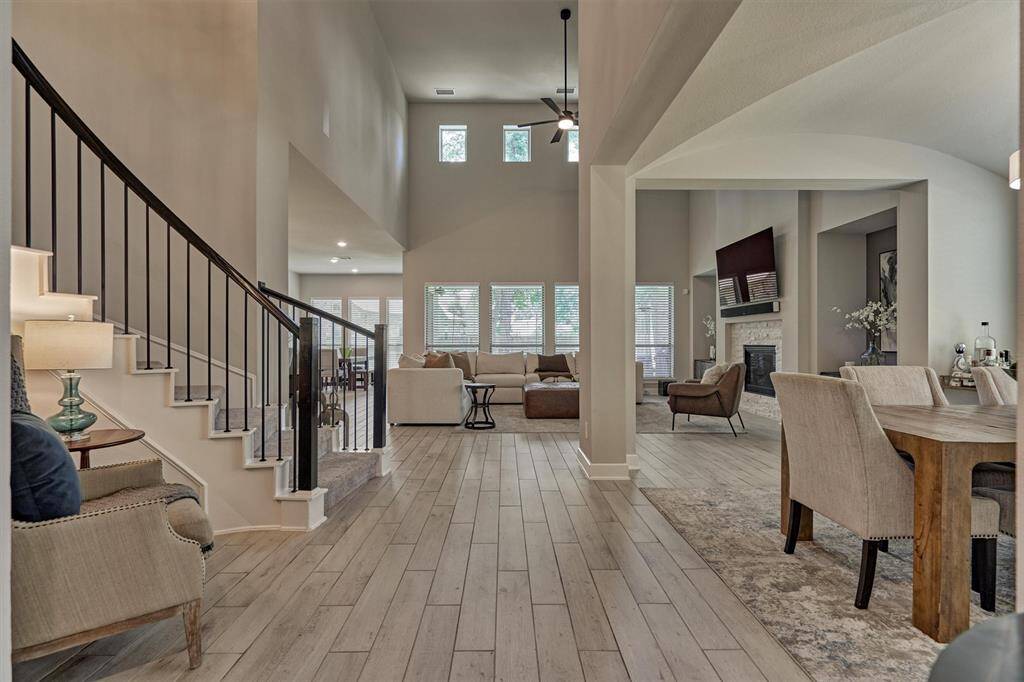 As You Progress Further Into This Elegant Home, You Will Notice That The Tall Ceilings Really Compliement The Open Floor Plan Concept.