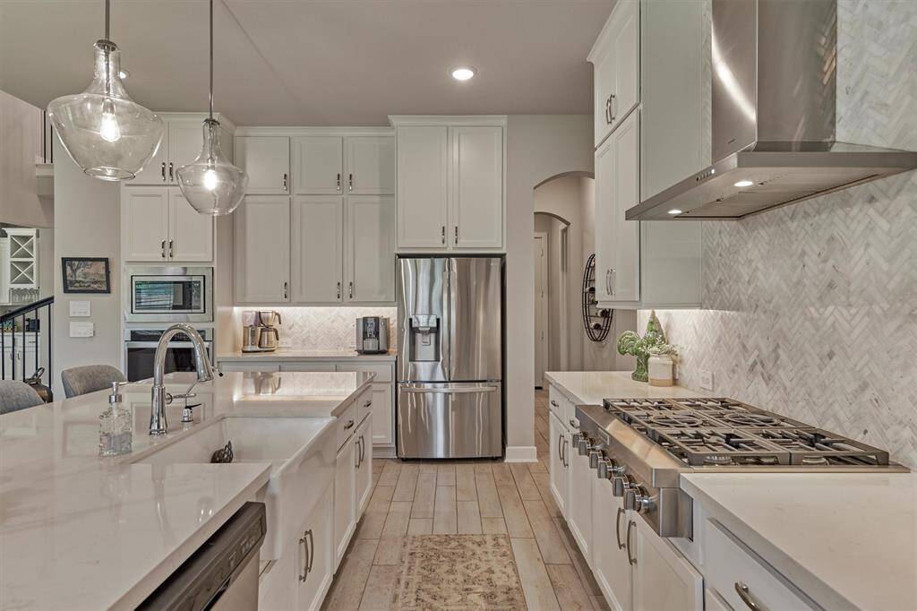 The Kitchen Offers Quartz Counters, Stainless Steel Appliances (Note The Professional Gas Cooktop), Recessed Lights, Under-Cabinet Lighting, A Stylish Herring Bone Back Splash, And Uppers That Increase The Kitchen Storage Space.
