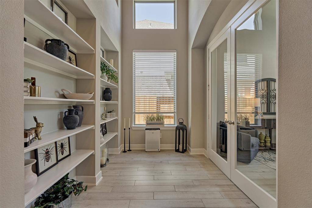 Tucked Away Off The Front Entry Is A Private Study, Ideal For Working From Home And Needing To Minimize Distractions. Note The Wall Of Built-In Shelving As Well.
