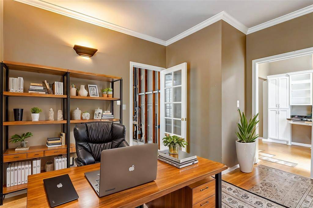 This versatile room offers privacy and flexibility, with French doors leading to an adjoining space—ideal for a study, hobby room, or reading nook.