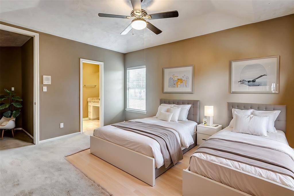 A tranquil retreat with neutral tones, plush carpeting, and an attached bath, this bedroom ensures comfort and privacy.