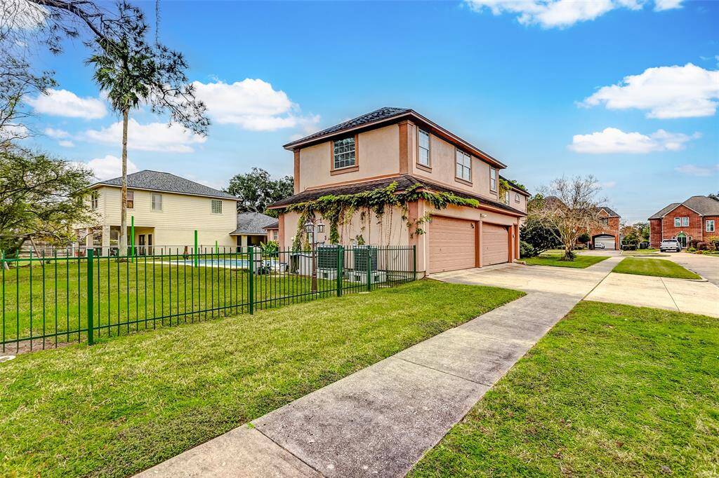 A spacious three-car garage offers convenience, while the fenced-in backyard features a sparkling pool and patio—ideal for outdoor entertaining and family fun.