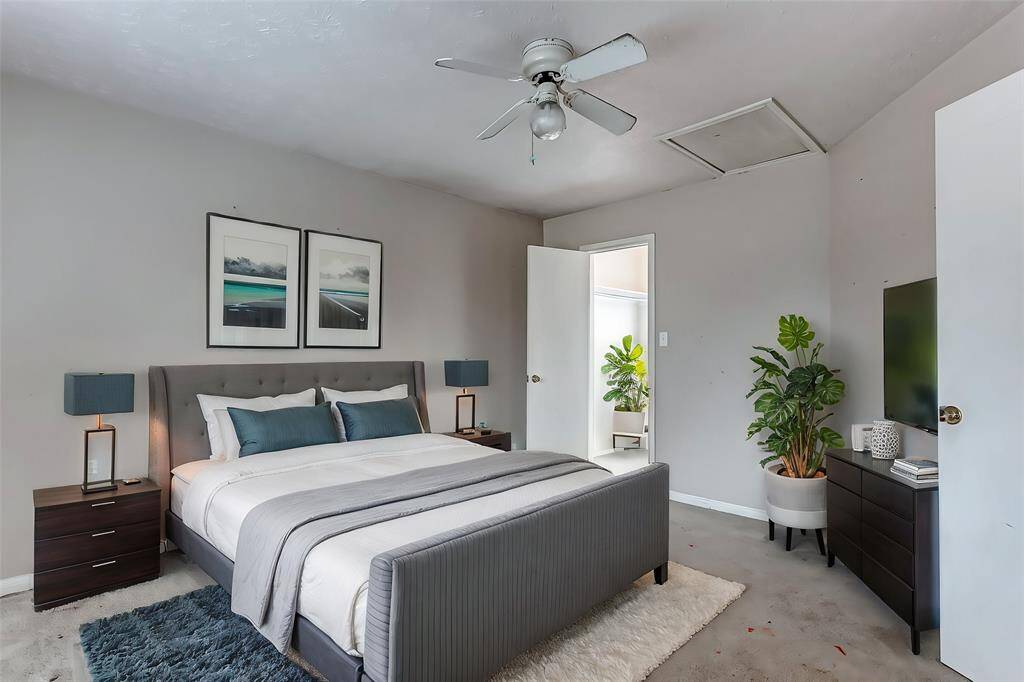 Another airy bedroom with a clean, neutral palette, ideal for a child’s room, guest room, or home office setup.
