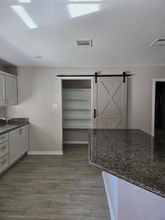 Walk-in pantry with sliding barn door