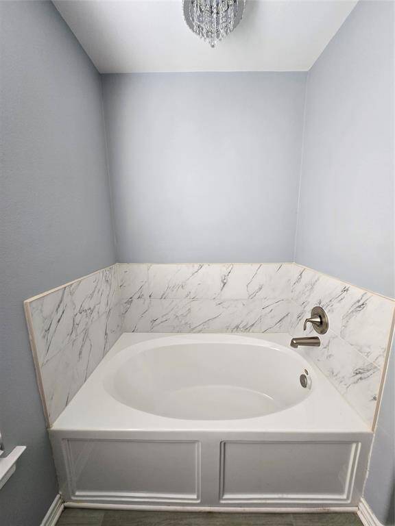 Separate bath tub in Master Bathroom