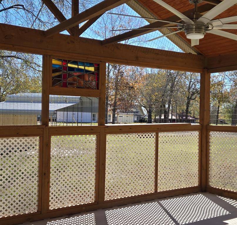 Stained glass window in screened porch