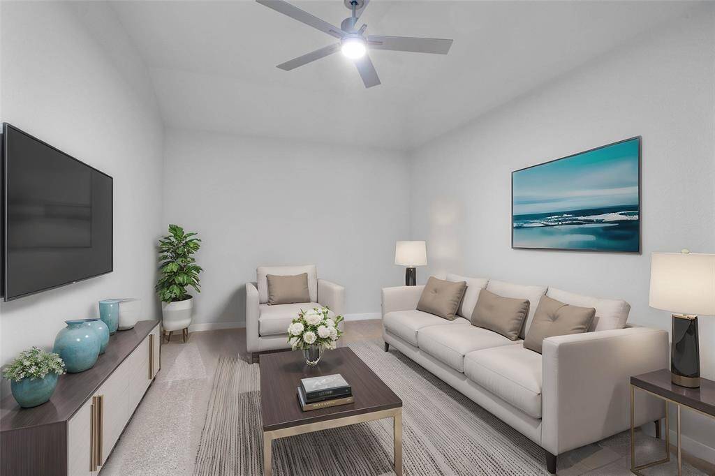 Grab the popcorn, put on a movie, and enjoy a wonderful evening in your amazing media room! Featuring plush carpet, custom paint, and ceiling fan makes this the perfect room for relaxing!