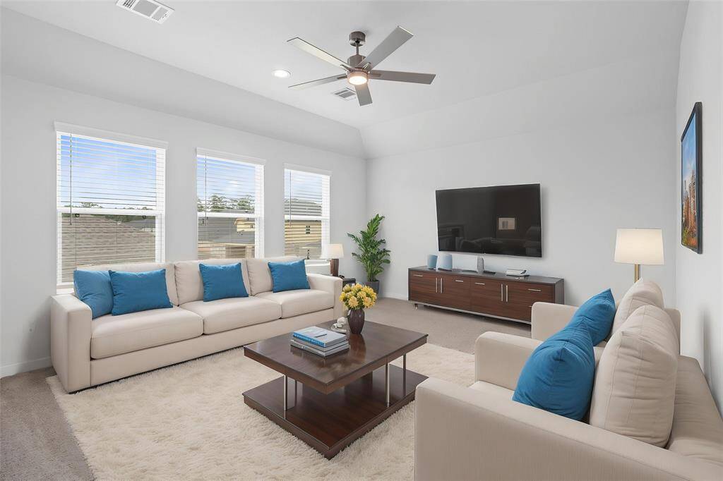 Come upstairs and enjoy a day of leisure in this fabulous game room! This is the perfect hangout spot or adult game room, this space features plush carpet, high ceiling with ceiling fan, recessed lighting and custom paint.