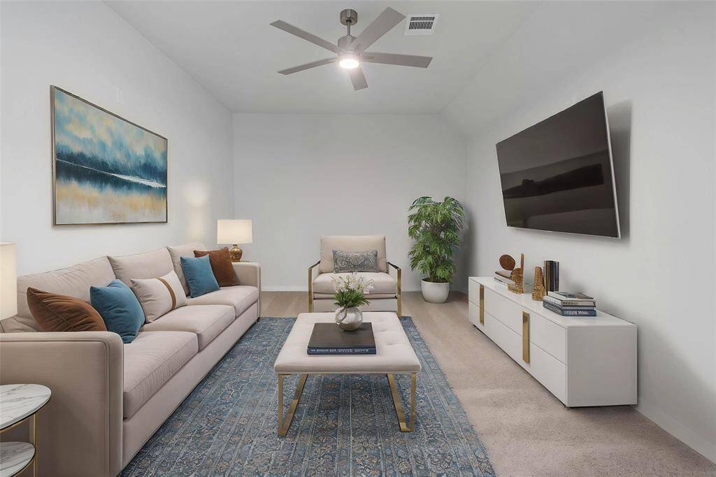 Grab the popcorn, put on a movie, and enjoy a wonderful evening in your amazing media room! Featuring plush carpet, custom paint, and ceiling fan makes this the perfect room for relaxing!