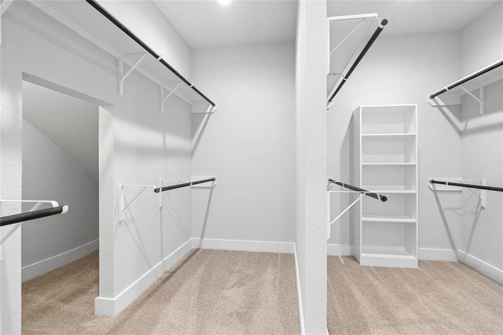 Look at this immaculate closet! With high shelving, multiple rows to hang clothing, you are sure to have enough room for all your belongings!