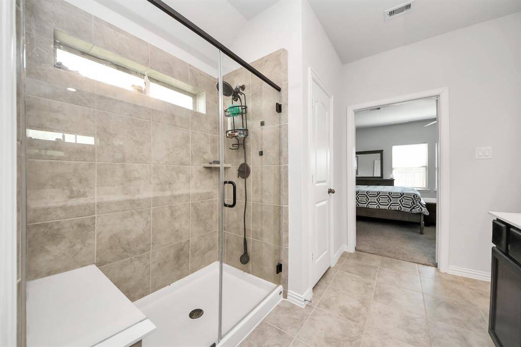 Extended Shower with sitting area.
