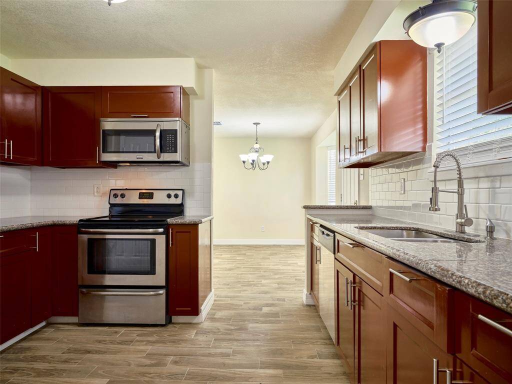 Newer cabinets, appliances and granite countertops.