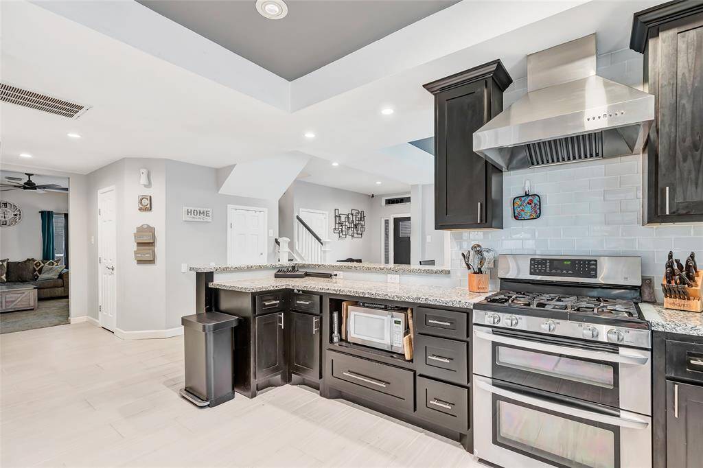 Another view of the kitchen. To the left is the living room.