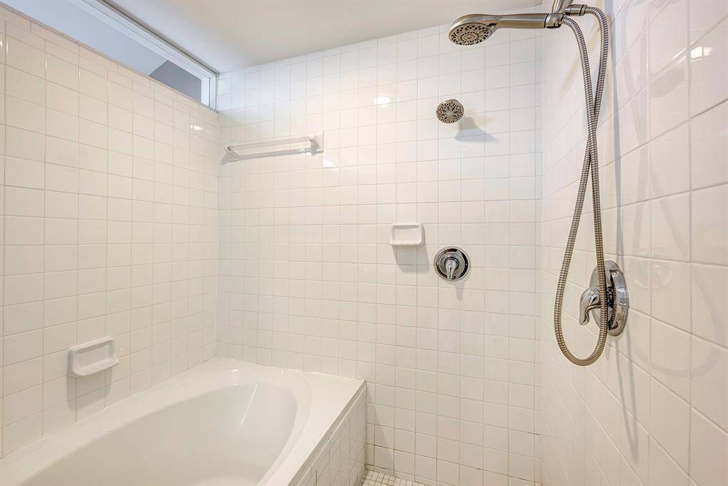Primary bath offers dual cultured marble vanities,tile flooring and a Euro separate tub and shower.