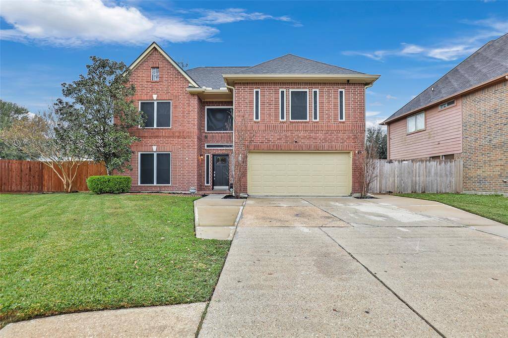 Welcome to 318 Dunford Ct Highlands, TX 77562. Oversized Driveway makes parking multiple cars a breeze.